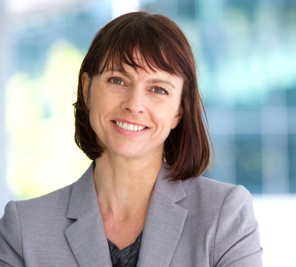 Close up portrait of a professional business woman smiling outdoor